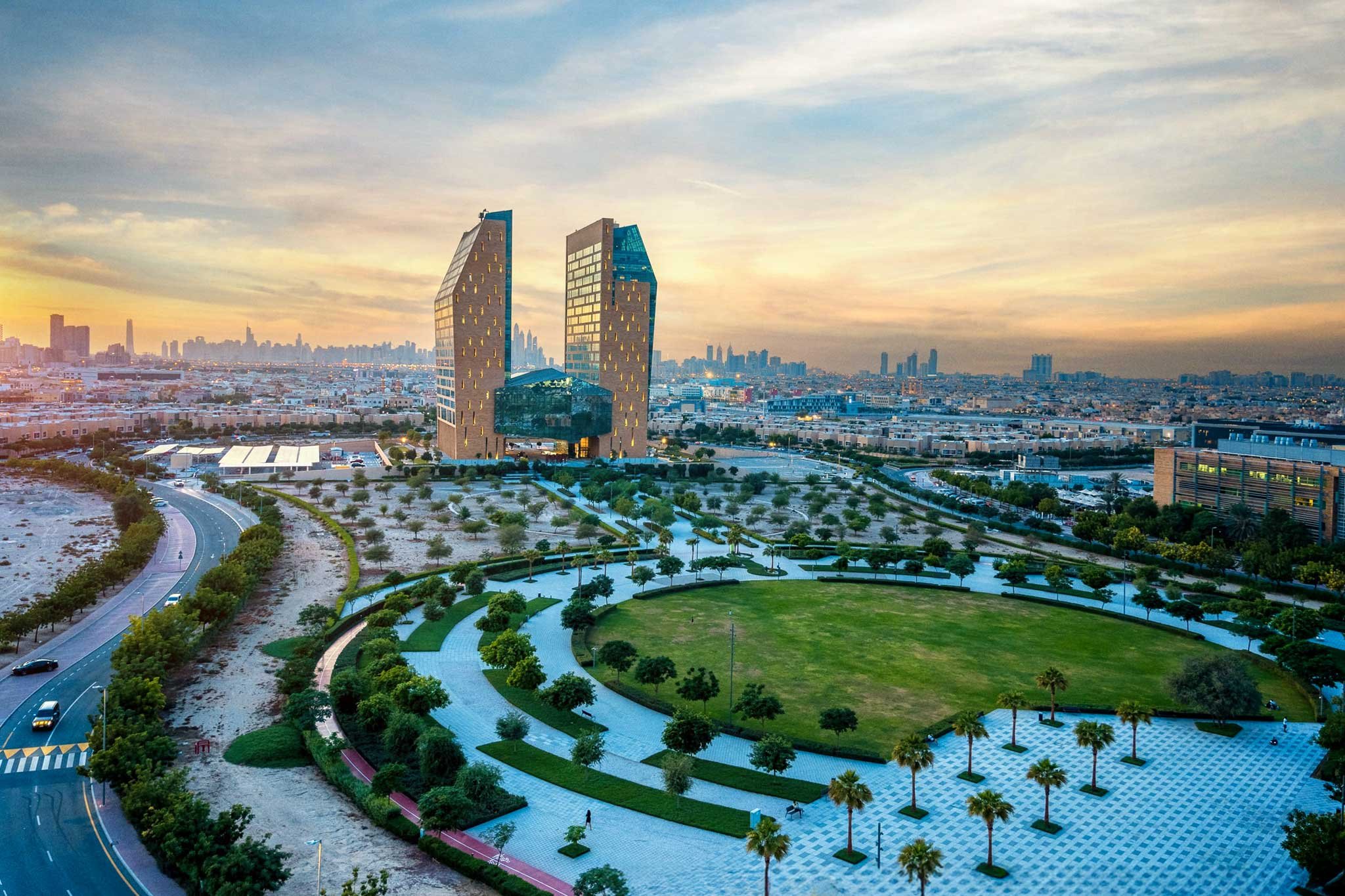 Dubai Science Park at sunset, with its park and twin towers