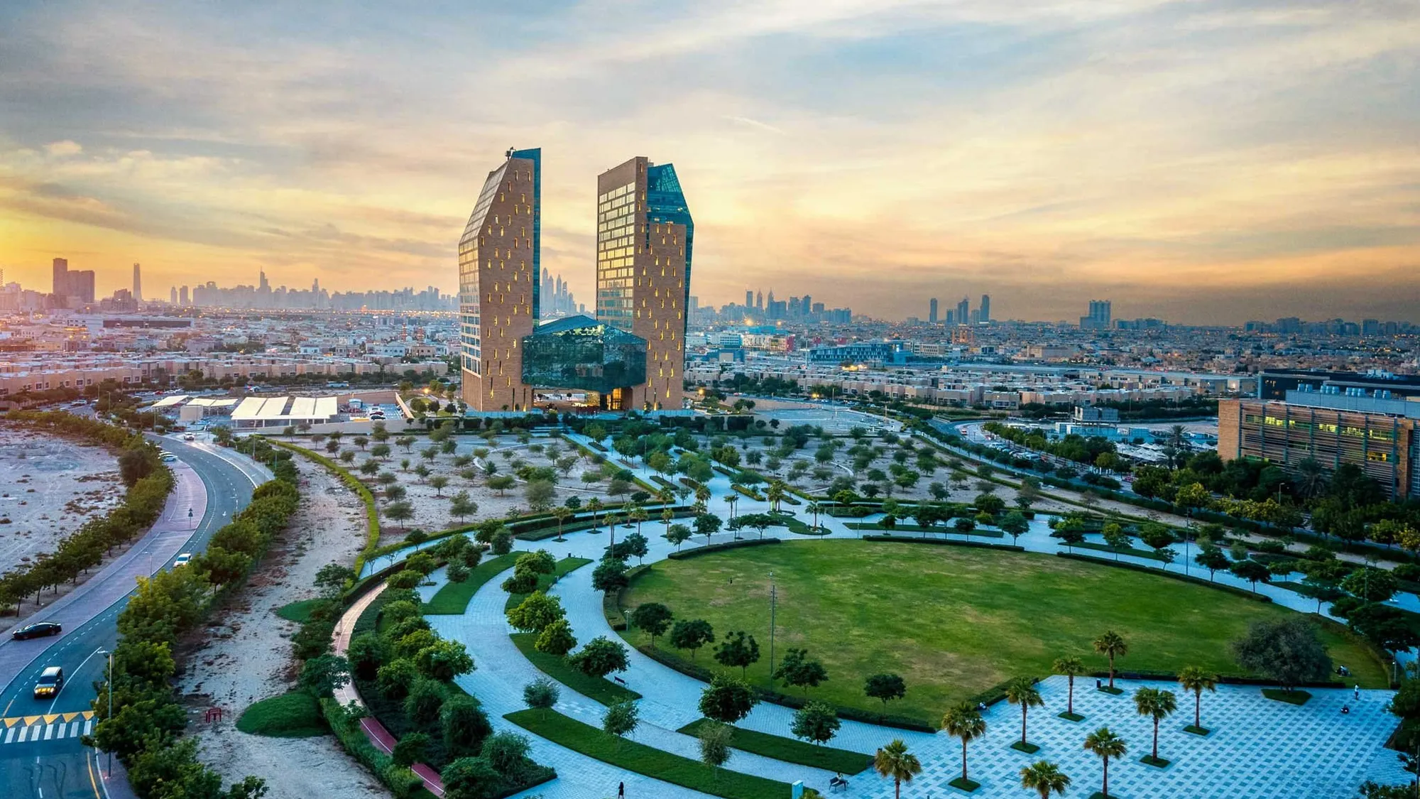 Dubai Science Park at sunset, with its park and twin towers